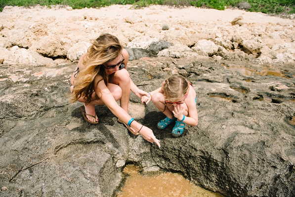A nanny exploring tide pools in Ko Olina