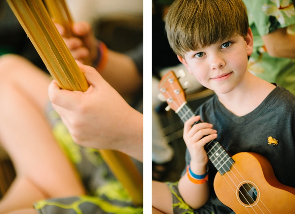 A boy holding a ukulele at Disney Aulani