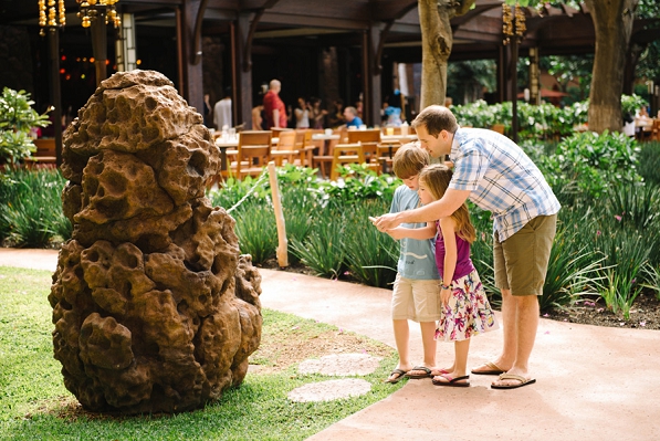 A dad with two kids doing the Disney Aulani treasure hunt