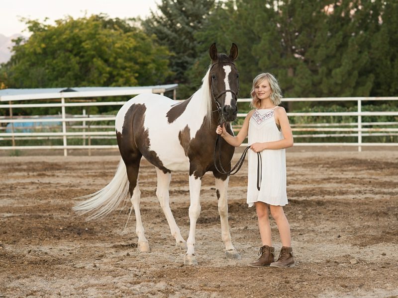girl in white dress with paint horse