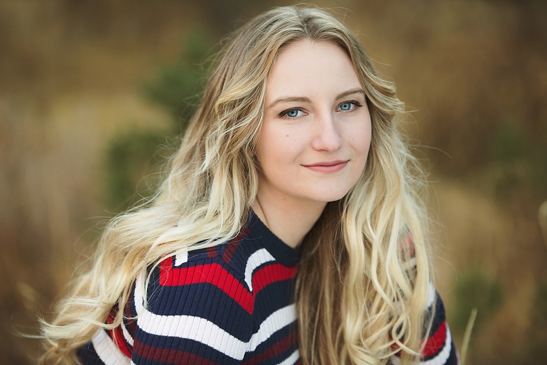 Girl in striped sweater in the fall. Amanda Nelson Photography senior portraits