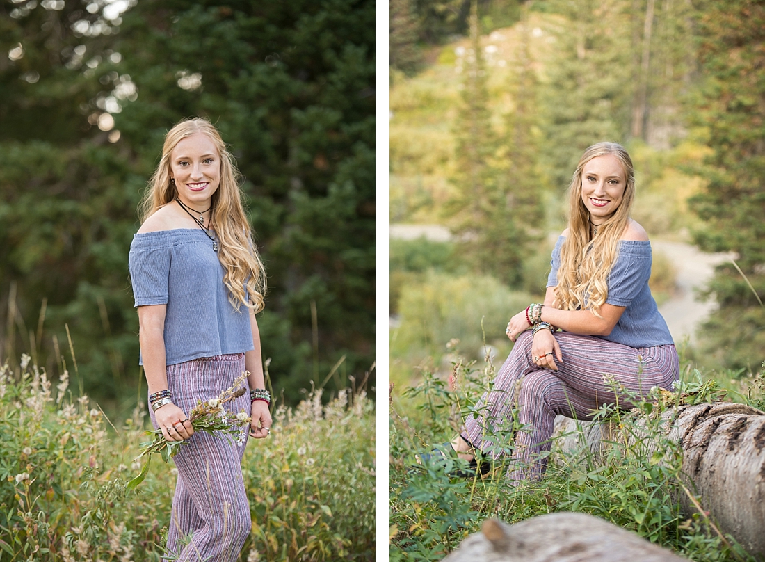 Utah Senior Portraits wearing blue off the shoulder shirt in the wildflowers and pine trees