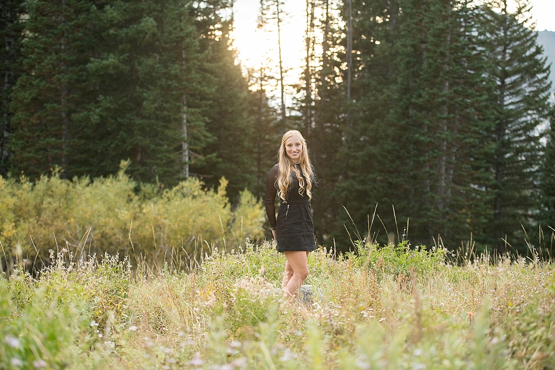 Utah Senior Portraits in the mountains with pine trees and wildflowers