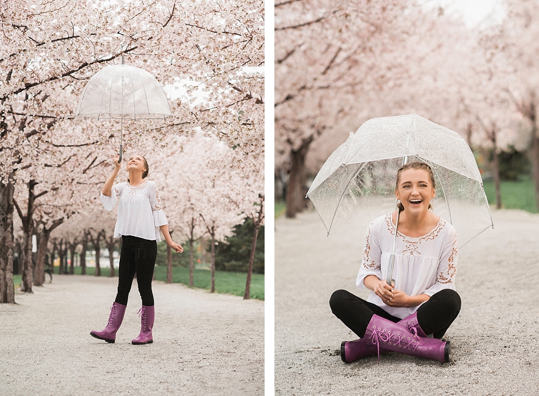 Skyline High School senior portraits. Girl with umbrella on path with pink blossoms