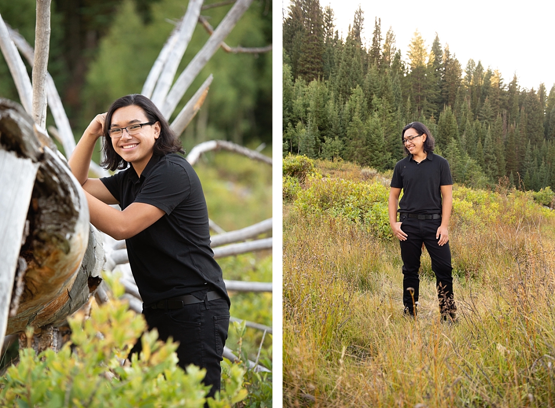 Waterford Senior Portraits in Utah mountains against a fallen tree. Black shirt and pants.