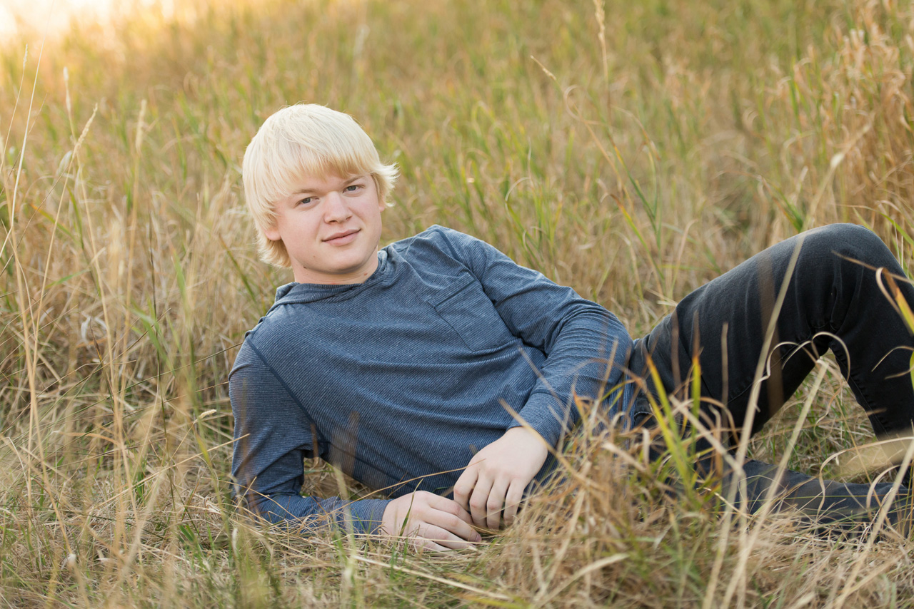 Park City Senior Portraits in tall grass at the golden hour