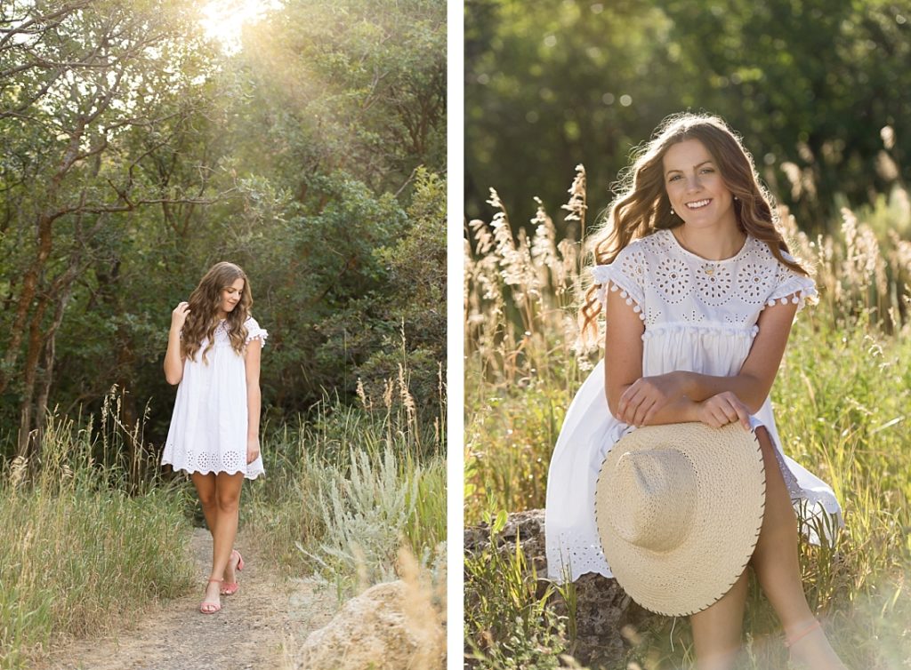 girl in white eyelet dress with sunflare and holding hat