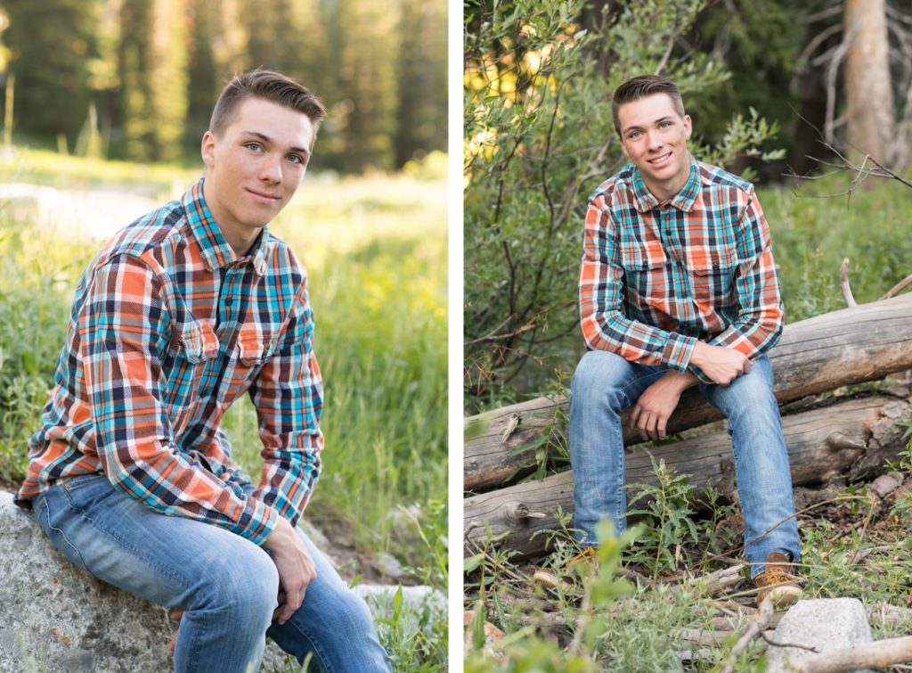 waterford school senior boy wearing plaid shirt sitting on a log in the mountains