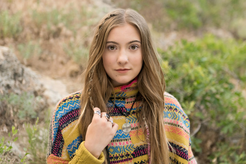 Girl in yellow striped sweater touching her hair | Amanda Nelson Photography