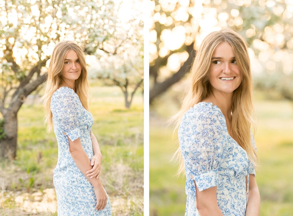 Olympus High School girl in blue flowered dress in a blossoming orchard