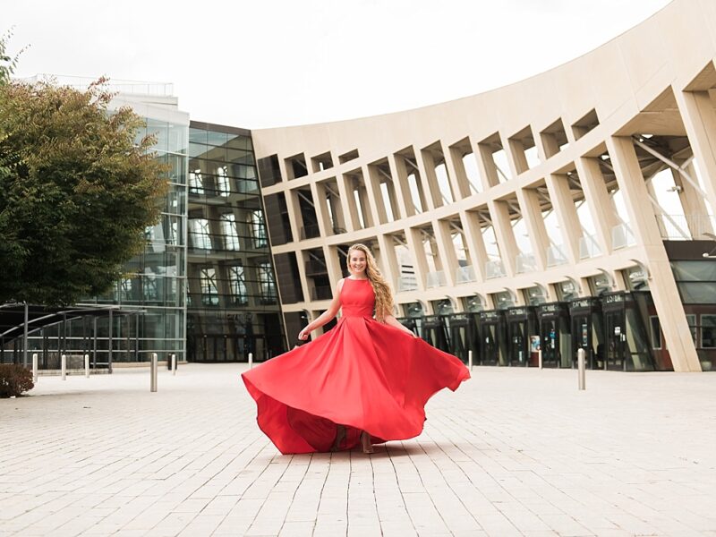 girl in red prom dress twirling at salt lake city library | Amanda Nelson Photography