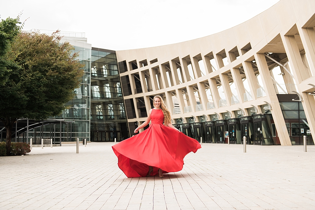 girl in red prom dress twirling at salt lake city library | Amanda Nelson Photography