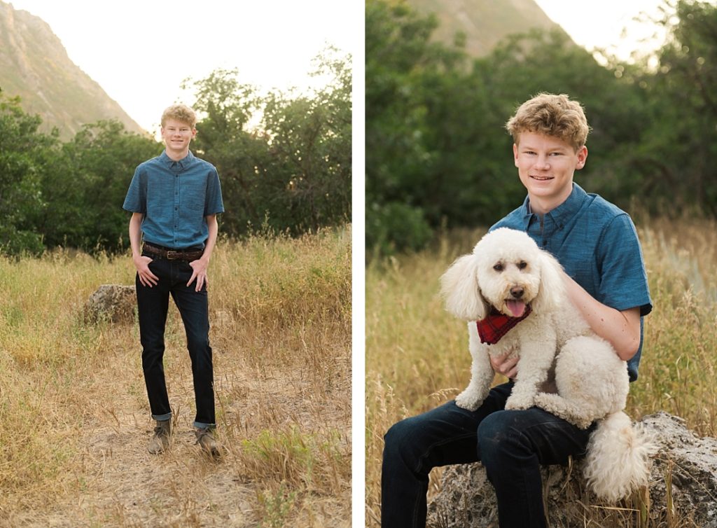 Utah senior portraits with blue button-up shirt standing in a mountain meadow
