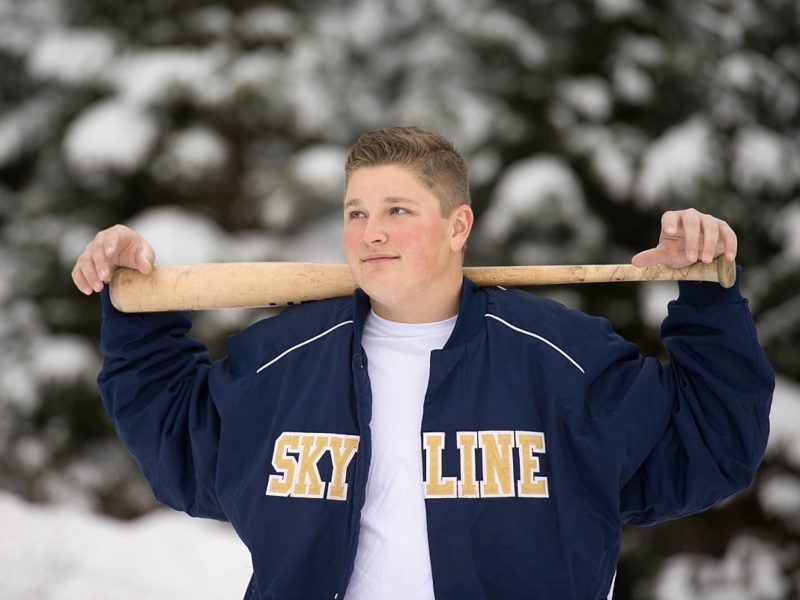 Skyline High School Baseball player with his bat behind his neck