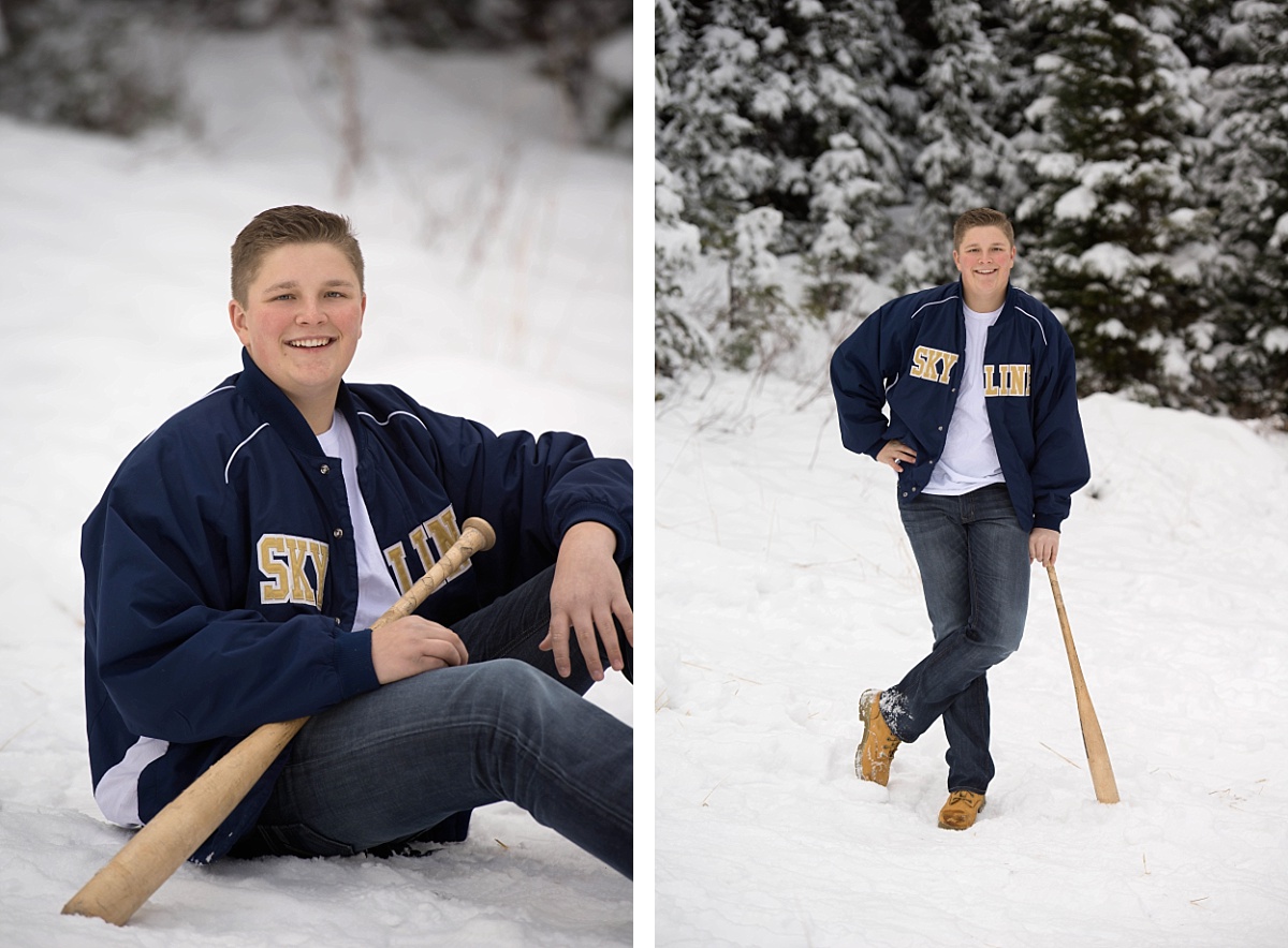 Boy wearing his skyline high school baseball jacket and holding a bat in the snowy mountains