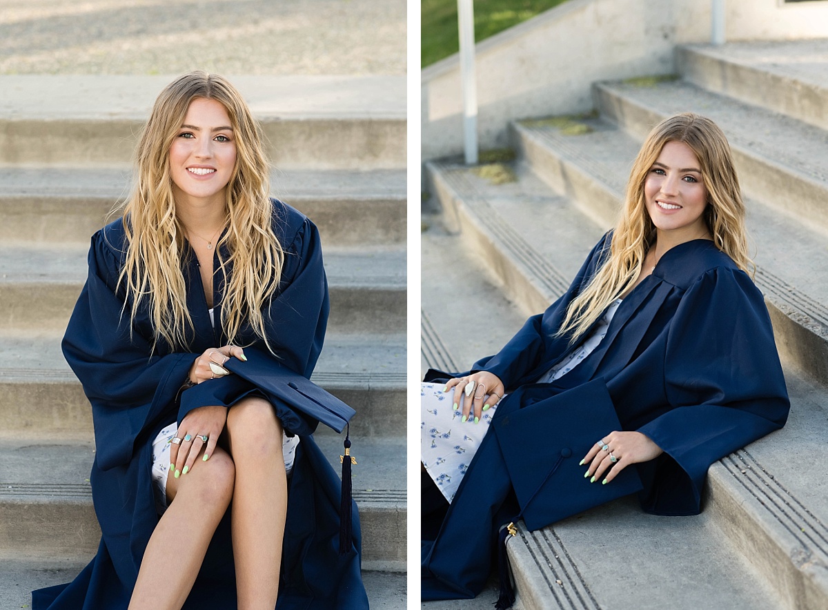 Girl in blue cap and gown sitting on cement stairs