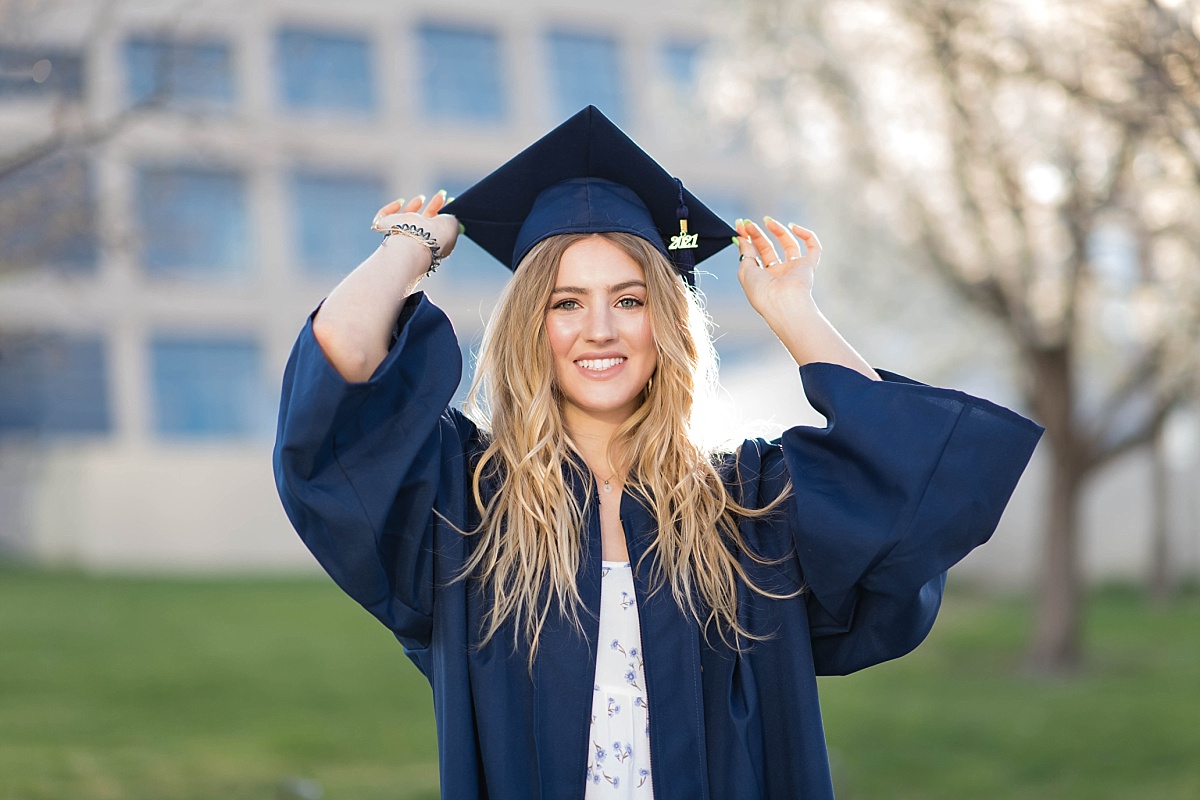 Girl in a blue cap and gown