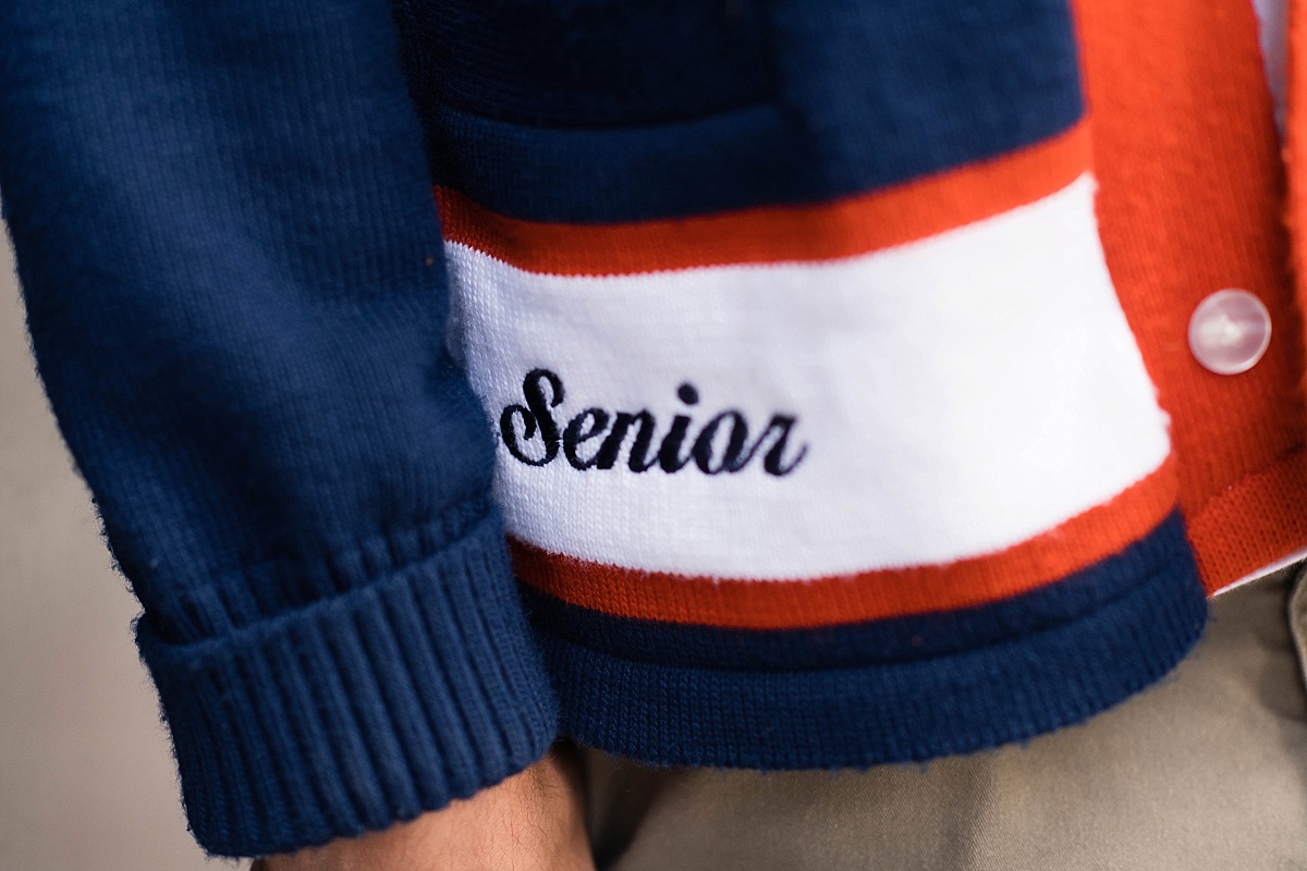 boy in student body officer sweater, brighton high school, utah senior portraits