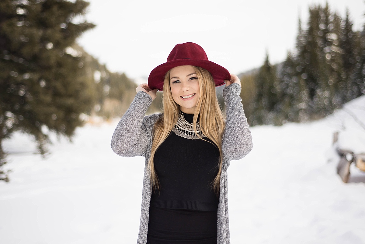 girl in the winter wearing a red hat